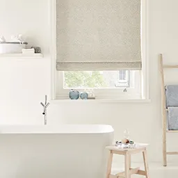 a white bath tub sitting next to a window