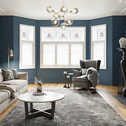 a living room filled with furniture and a chandelier