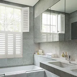 a bathroom with a sink, mirror and bathtub