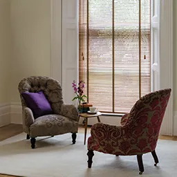 a living room filled with furniture and a large window